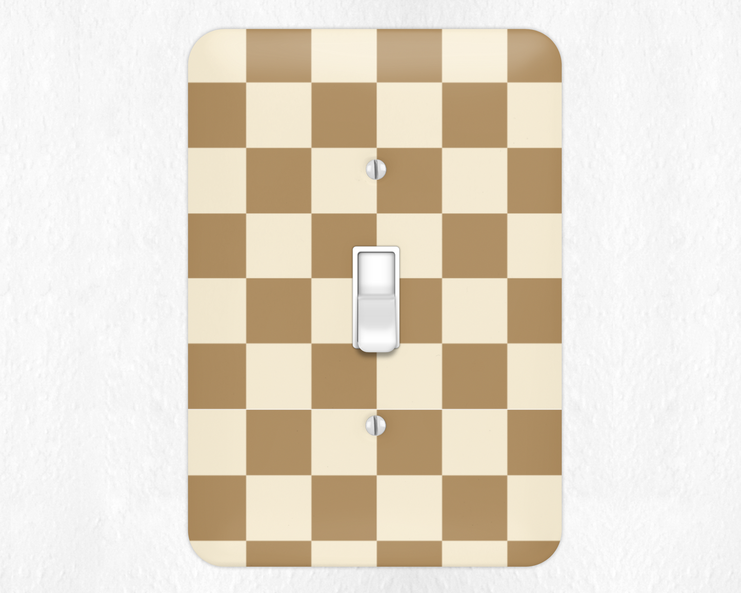 Checkered light switch cover with a beige and brown pattern on a white background