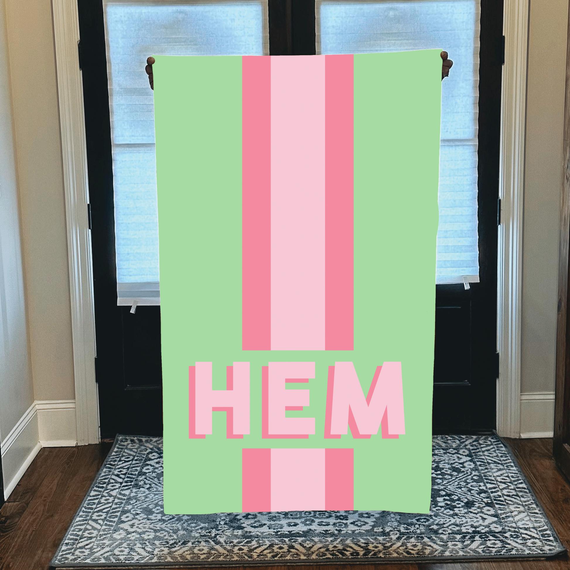 Personalized beach towel with custom monogram and green and pink striped pastel design